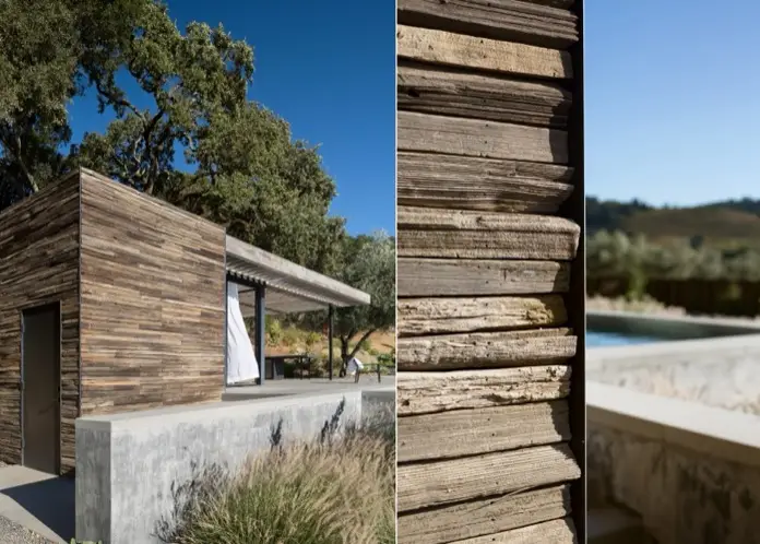 Cuarto exterior revestido con madera recuperada.